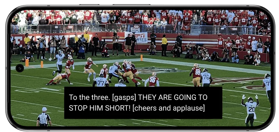 a mobile phone showing expressive captions on YouTube.
