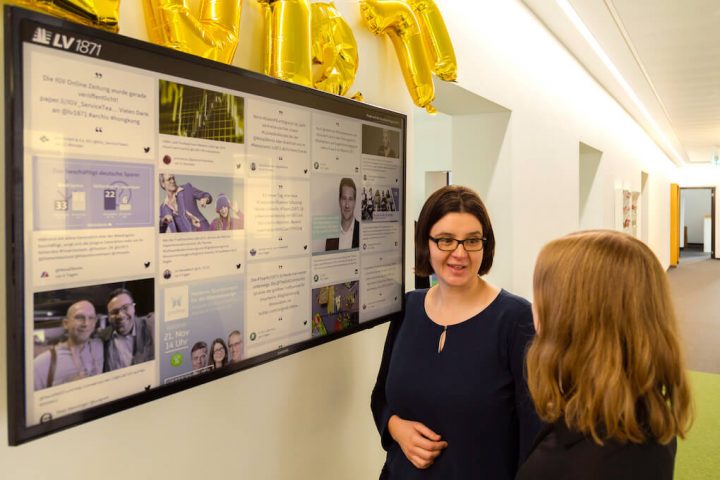 corporate influencer social wall displayed at the office.